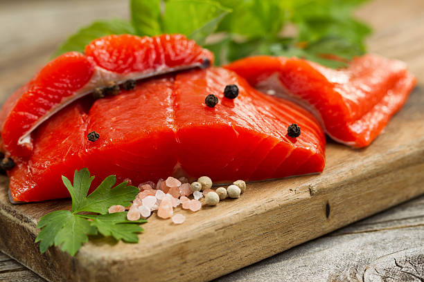 Fresh Copper River Salmon fillets on rustic woode