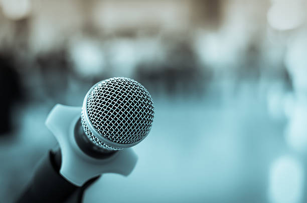 istock Close up of microphone in conference room on blurred background 479766936