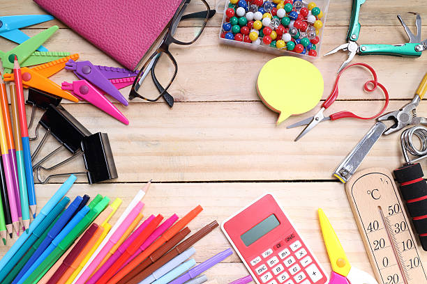 istock School and office stationary on wood table 479767246