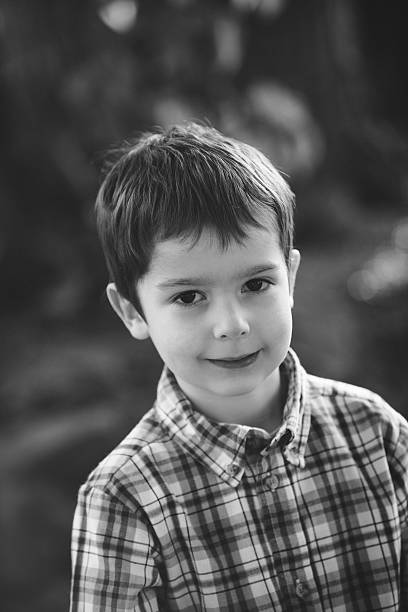 istock Boy standing in his backyard on a sunny day 479774062