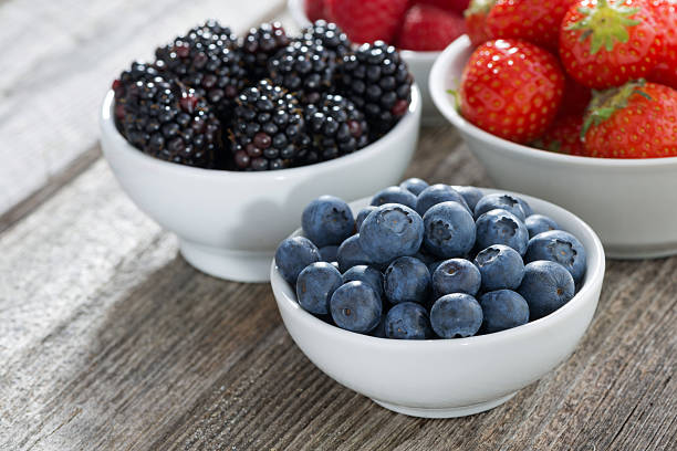 istock blueberries in a bowl and fresh garden berries 479774524