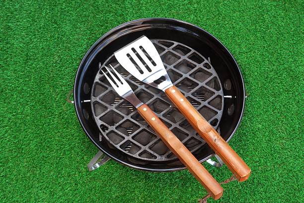 istock Close-up Overhead View Of BBQ Grill With Tools On Lawn 479777306