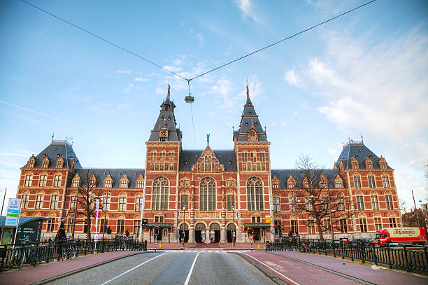 Amsterdam, The Netherlands - April 16, 2015: Netherlands national museum with people in Amsterdam. The Rijksmuseum is dedicated to arts and history in Amsterdam.