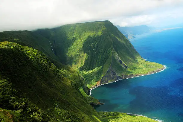 Aerial view of a part of Molokai island coast and Kahiwa falls, Hawaii (View from a helicopter)