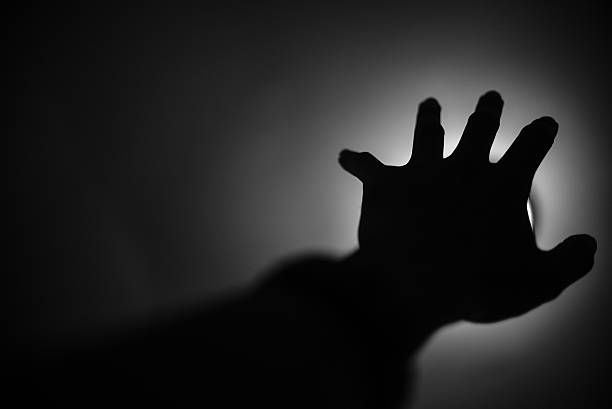 istock Silhouette of hand reaching to light, Help me concept 479787004