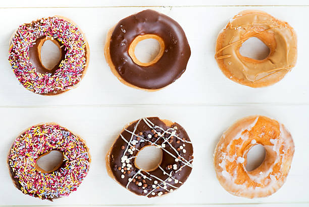 istock Glazed Doughnuts with colourful sprinkles, chocolate, icing 479795296