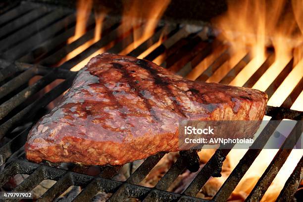 Beef Steak On The Bbq Flaming Grill Closeup Stock Photo - Download Image Now - Barbecue - Meal, Barbecue Grill, Fire - Natural Phenomenon