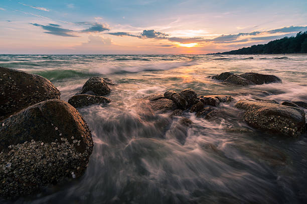 istock Wonderful sky of sunset and wave over boulders 479800724