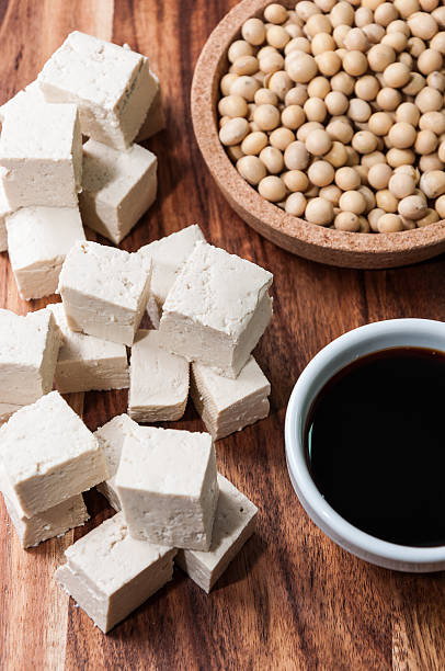 istock Piece of tofu and soy beans on a cutting board 479804316