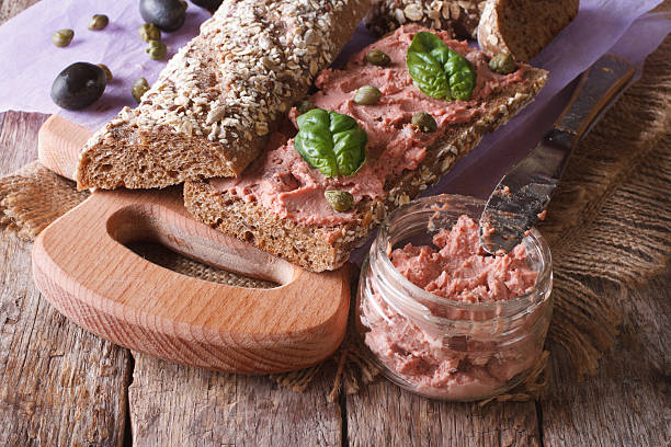 istock Sandwich with goose pate, capers and basil close-up 479804618