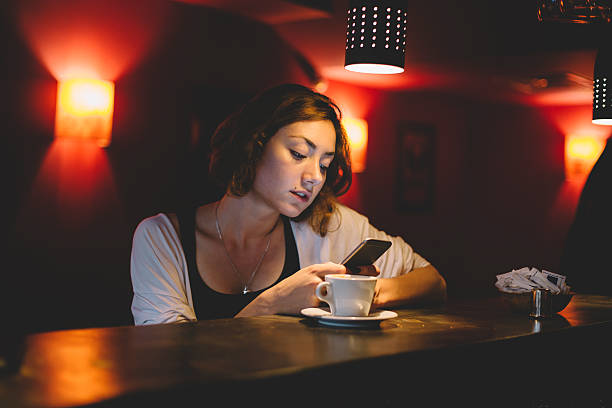 istock Girl using smartphone in a cafe 479805462