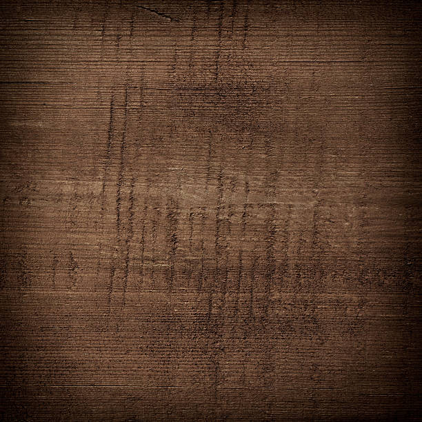 istock Dark brown scratched wooden cutting board. Wood texture 479806560