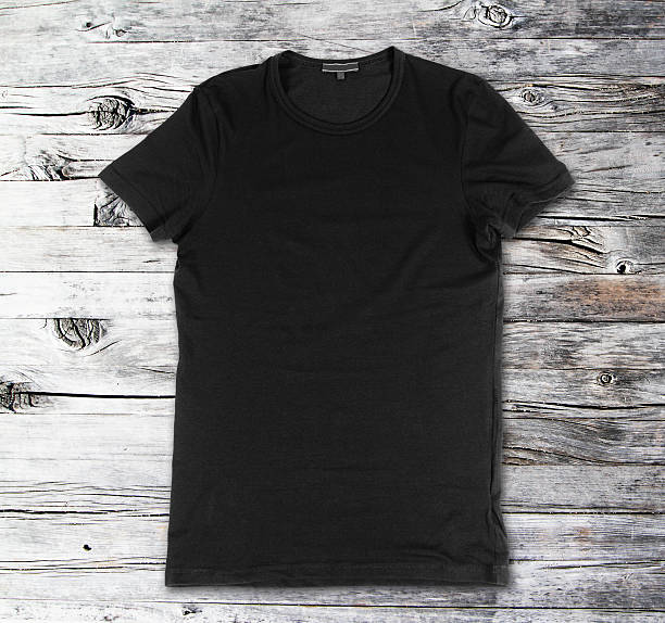 istock Blank black t-shirt on a wooden surface 479809790