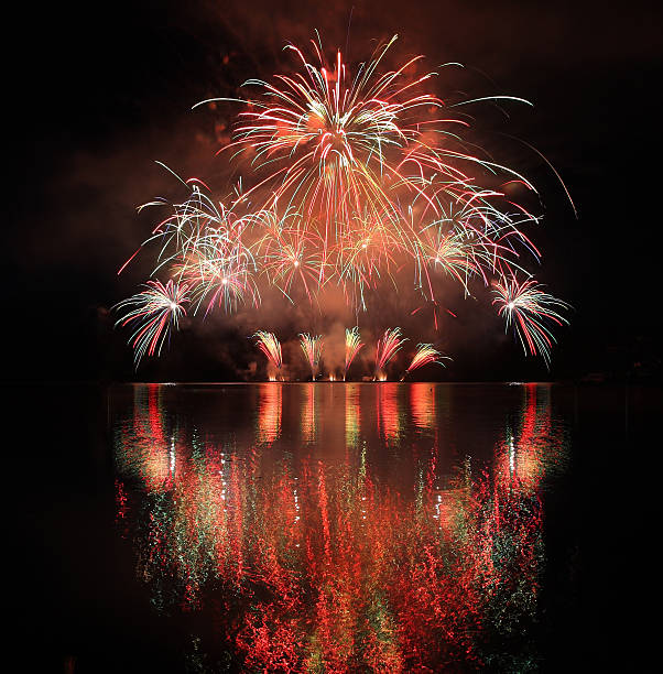 istock Colorful fireworks with reflection on lake. 479810420