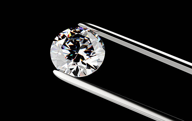 istock Diamond in the tweezers 479814548