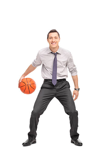 istock Young businessman playing basketball 479814562