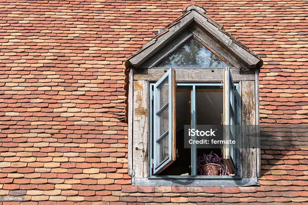 open window in an old dormer open window in an old dormer made of wood on a roof with historic beaver tail tiles, copy space 2015 Stock Photo
