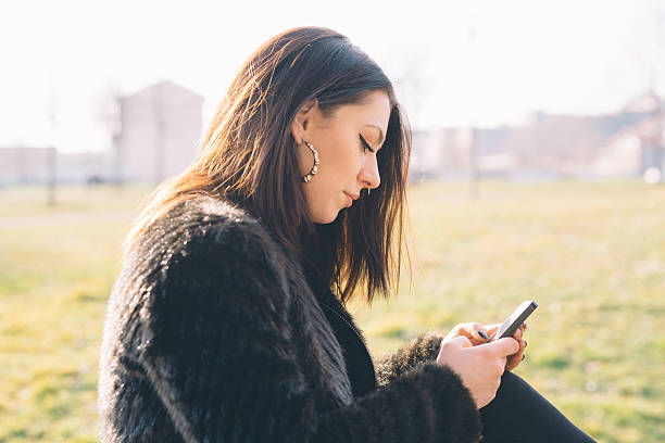 istock young beautiful woman using smartphone 479825790