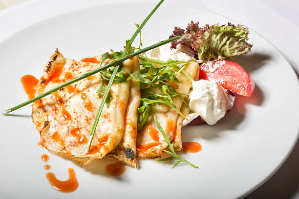 istock Savory crepes with tomato and cream 479831268