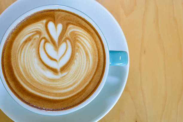 istock Cappuccino on wooden table brown color 479835890
