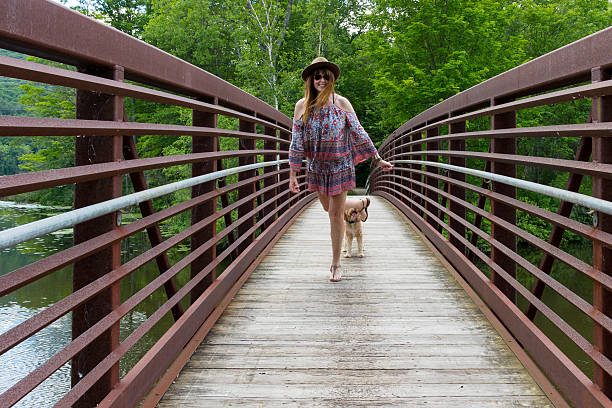 istock Woman and Puppy Running on Boardwalk 479845146