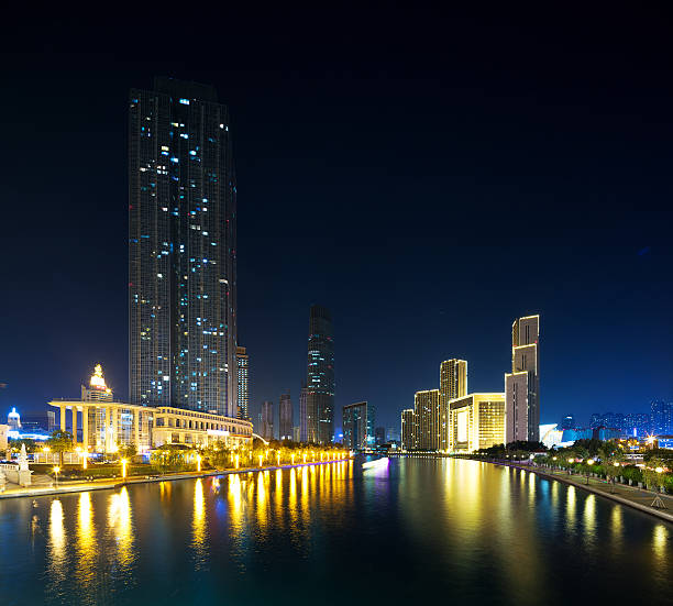 istock Illumintaed modern skyscrapers and skyline at riverbank 479845298
