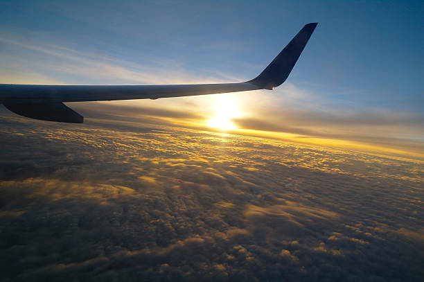 istock airplane flying high in the sky 479849844