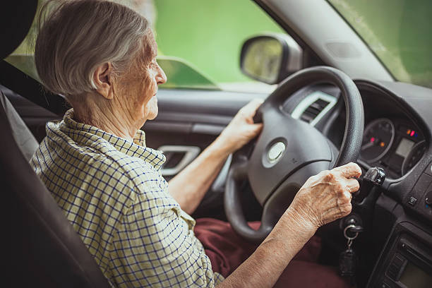 istock Senior woman driving a car 479850032