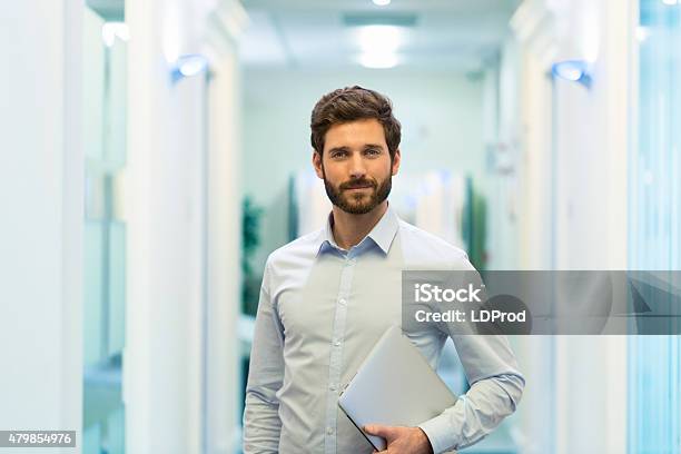 Portrait Of Handsome Bearded Business Man In Corridor Office Stock Photo - Download Image Now
