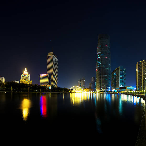 istock Illumintaed modern skyscrapers and skyline at riverbank 479855568