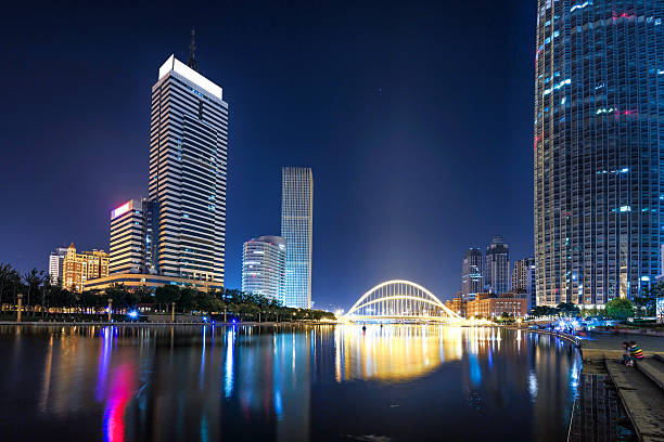 istock Illumintaed modern skyscrapers and skyline at riverbank 479855572