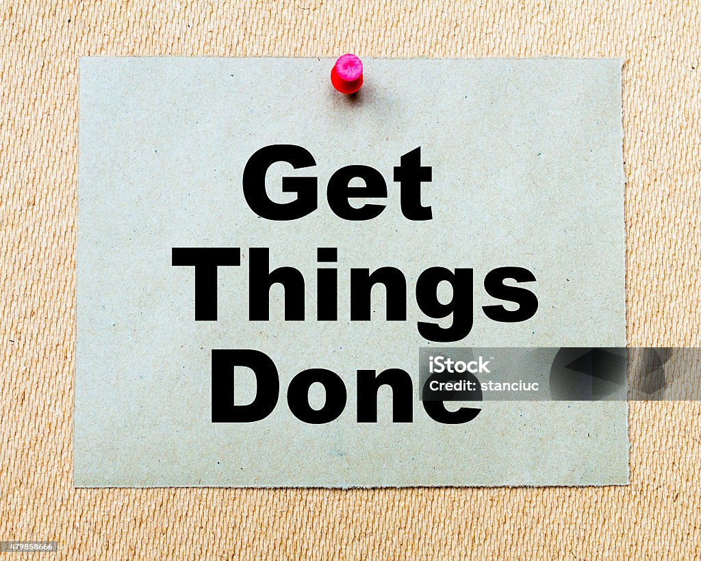 Get Things Done written on paper note Get Things Done written on paper note pinned with red thumbtack on wooden board. Business conceptual Image 2015 Stock Photo