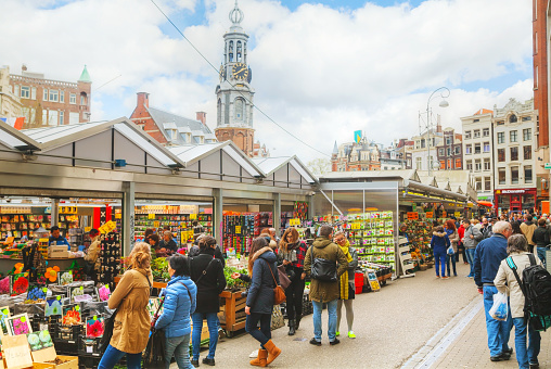 Amsterdam, The Netherlands - April 17, 2015: Floating flower market with people in Amsterdam, Netherlands. Itâs usually billed as the âworldâs only floating flower marketâ.