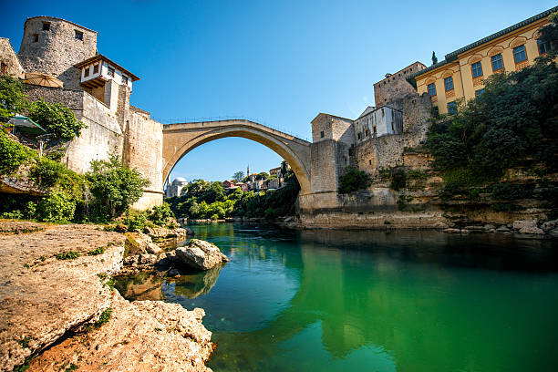 Mostar city view Beautiful view on Mostar city with old bridge and ancient buildings on Neretva river in Bosnia and Herzegovina stari most mostar stock pictures, royalty-free photos & images