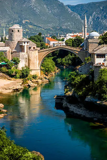 Beautiful view on Mostar city with old bridge and ancient buildings on Neretva river in Bosnia and Herzegovina