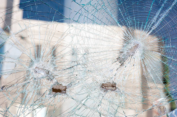 istock holes from shots in the shop window 479863082
