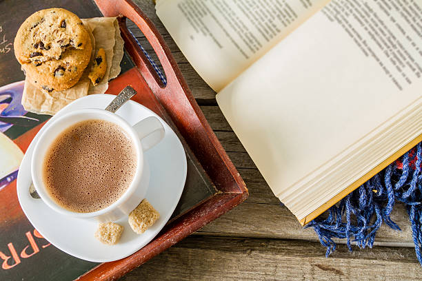 istock Hot chocolate in white cup, cookies, book, blanket 479867812