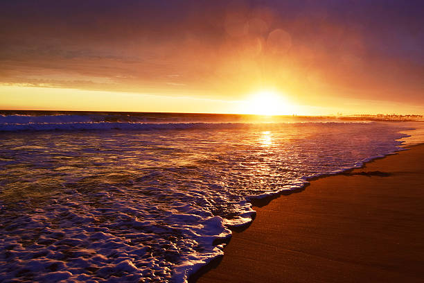 A beautiful summer sunset in Newport Beach, Southern California just after a storm. Newport is a beach community in Orange County.