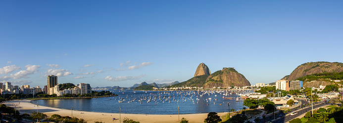 This photo showcases the awe-inspiring skyline of Rio de Janeiro, Brazil. The cityscape is a magnificent display of architectural and natural wonders. The photo captures the bustling metropolis with its vibrant streets, colorful buildings, and modern infrastructure, making it an ideal choice for travel brochures, websites, or any project that aims to highlight the beauty and wonder of this incredible city.