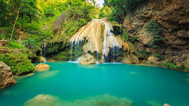 istock wonderful waterfall with colorful tree in thailand 479873042