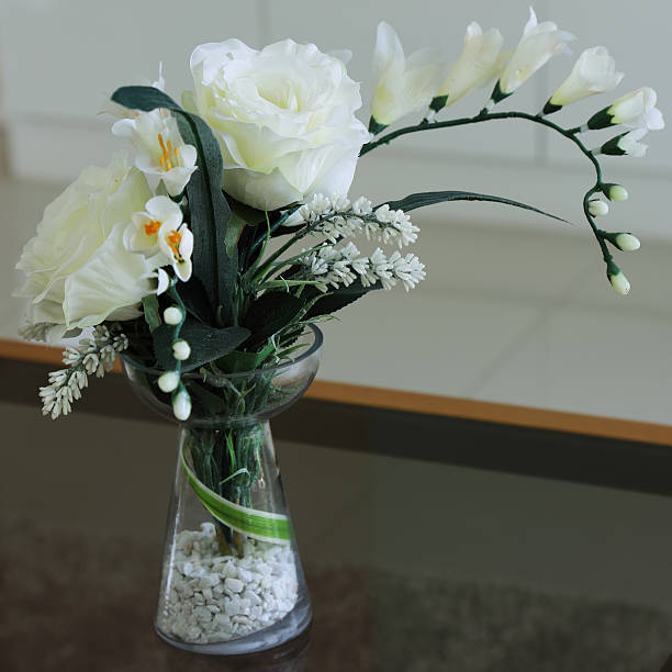 istock fake flower in a vase on the table 479873412