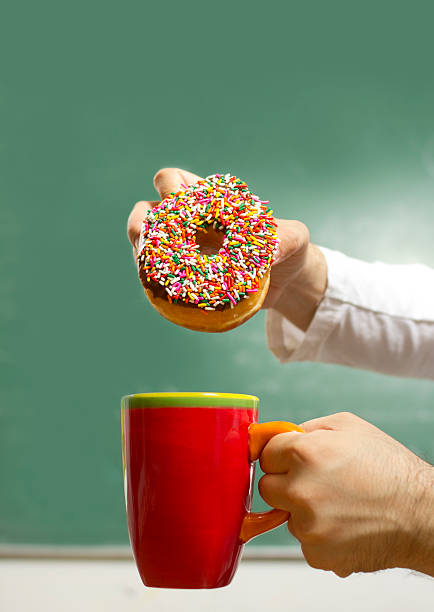 Donut dunking stock photo