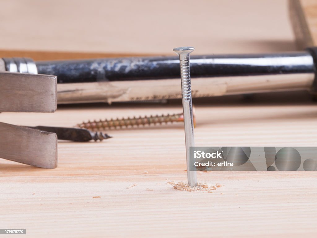 hammer and nail detail of a nail and a hammer 2015 Stock Photo