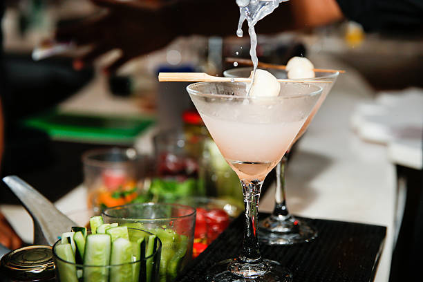 Pouring cocktails lychee martini