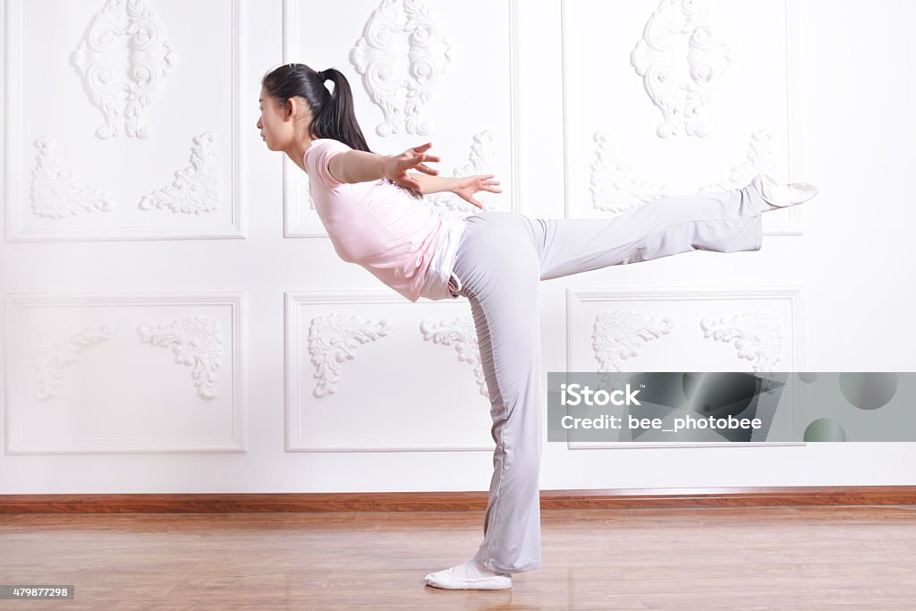 Yoga balance Beautiful young woman demonstrating Yoga balancing act 2015 Stock Photo