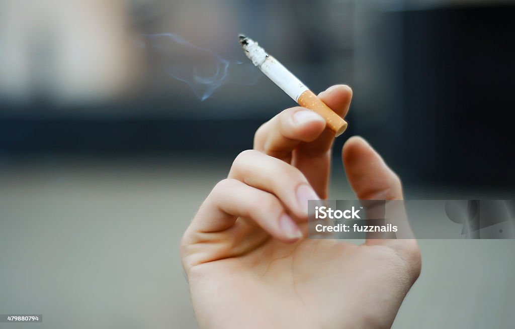 cigarette in the hand Cigarette Stock Photo