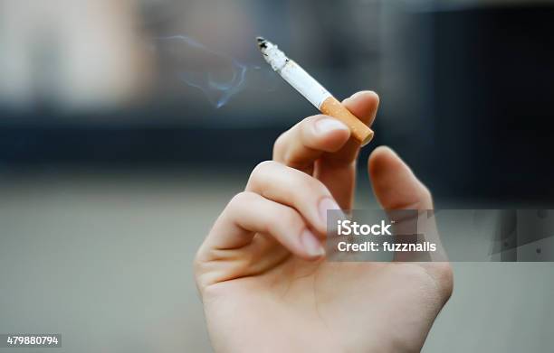 Cigarette In The Hand Stock Photo - Download Image Now - Cigarette, Smoking - Activity, Tobacco Crop