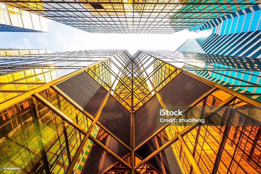 low angle view of modern skyscraper exterior and sky low angle view of modern skyscraper exterior and sky in modern city 2015 Stock Photo