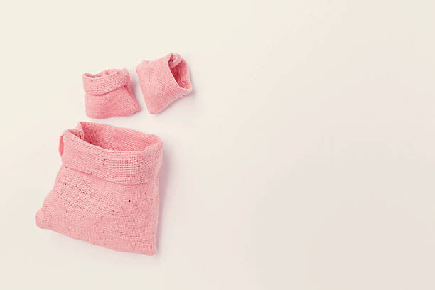 istock Pink fabric bag with space on background 479881596