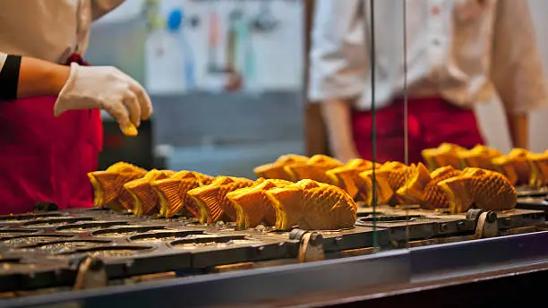 Taiyaki is Japanese fish shaped cake filled with sweet red bean paste.